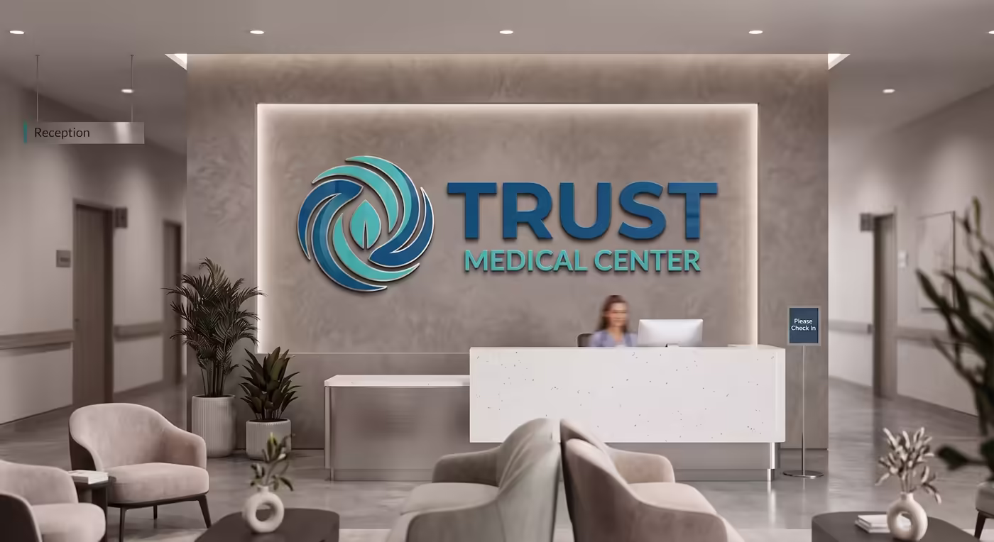 Trust Medical Center reception with the logo lit on the feature wall